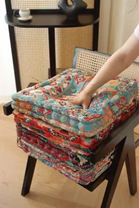 Detailed close-up of thick square seat cushion in retro pastoral style for home and office.