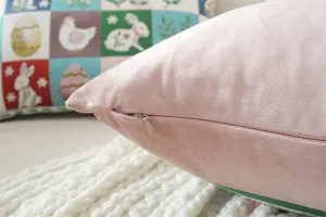 Pink velvet throw pillow cover with hidden zipper detail, soft and cozy home decor.