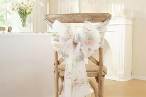Wedding chair sash tulle bow with colorful floral embroidery, elegant bridal decor for events.