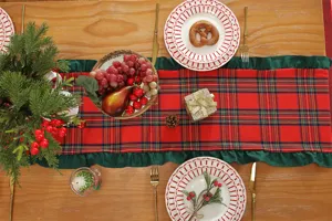 Christmas table runner red plaid yarn-dyed fabric with green ruffle edge for holiday decor.