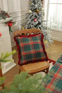 Christmas plaid decorative pillow with red ruffle trim, festive holiday home accent cushion for sofa.