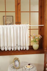 French white lace short cafe curtain with delicate hollow embroidery for home decor detail.
