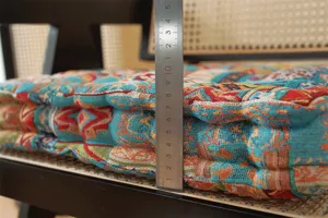 Detailed view of thick ethnic style seat cushion showing high quality fabric and plush filling.