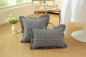 French pastoral style black and white plaid throw pillow with delicate cotton ruffle trim detail.