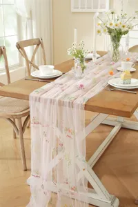 Pink lace embroidered table runner with vintage floral and butterfly pattern for wedding.