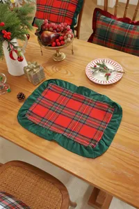 Christmas plaid table runner with ruffled edge, festive holiday dining decor and table mat setup.