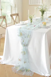 Blue lace table runner with vintage colorful floral embroidery for dining table decor.