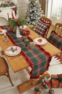 Christmas plaid table runner with red ruffle edge, festive dining table decor for holiday.