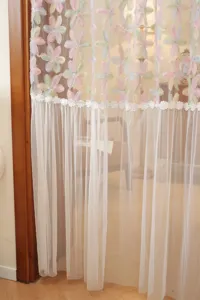 Detailed view of french style double layer floral embroidered lace door curtain elegant mesh.
