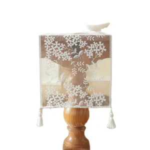 White lace table runner with floral embroidery and tassels, elegant home decoration cover.