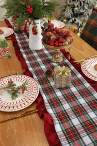 Christmas plaid table runner with red ruffle edge, festive holiday home dining decor.