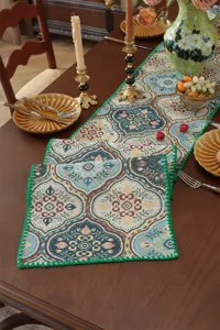 American vintage style table runner with paisley jacquard weave and green crochet edge detail.