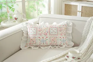 French style cotton floral ruffle throw pillow detail showcasing delicate pattern and ruffle.