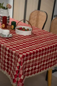 Festive jacquard tablecloth with gold lace trim, waterproof red checkered dining table cover.