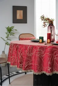 Red jacquard waterproof round tablecloth with gold leaf pattern and elegant lace border.