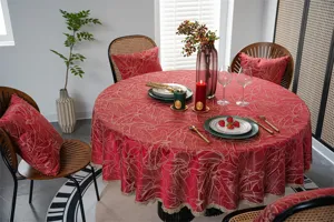Detailed showcase of the elegant red jacquard round tablecloth featuring luxury gold lace trim.