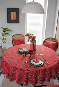 Festive red jacquard round tablecloth detail featuring gold lace for wedding home decor.