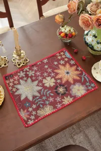 American retro woven table mat with floral jacquard design, elegant scalloped edge for dining.