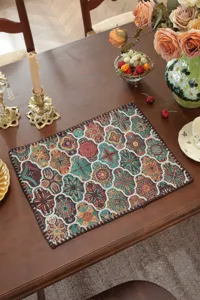 Detailed view of vintage woven placemat with rich pattern and exquisite floral texture.