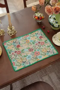 Detailed view of American vintage floral woven table runner, decorative placemat with green edge.