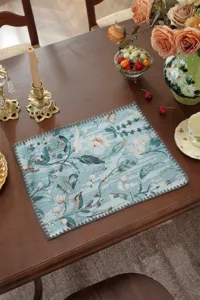Vintage floral table runner detail view, blue botanical jacquard pattern, elegant scalloped edge.