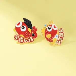 Detail shot of Japanese koi enamel pins featuring academic and lucky blessings for graduation.