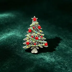 Detailed view of the vintage alloy Christmas tree brooch adorned with red and crystal rhinestones.
