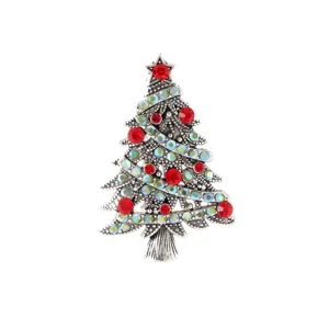 Vintage silver-tone Christmas tree brooch decorated with sparkling red and blue rhinestone crystals.