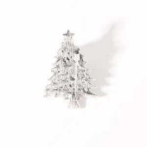 Detailed view showing the secure pin back and textured alloy craft of this Christmas tree brooch.