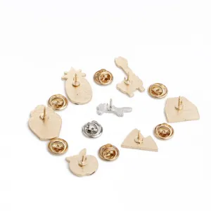 Metal cartoon brooch back details showing various cute shapes with secure butterfly clutches.