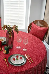 Festive red round tablecloth with gold jacquard design waterproof fabric for dining table.