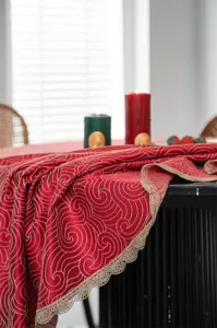 Red jacquard waterproof tablecloth with gold lace trim, elegant round table cover.