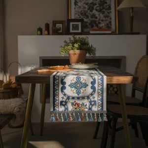 Modern minimalist geometric table runner with tassels, stylish fabric decor for dining table.