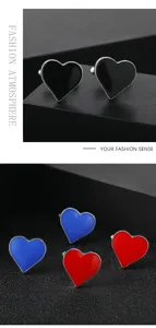 Detail shot of stylish heart-shaped enamel cufflinks in black, blue, and red for formal wear.