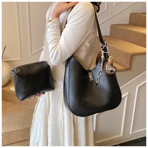 Black PU leather hobo shoulder bag for women, stylish commuting bucket bag with matching pouch