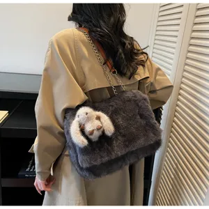 Winter fluffy plush crossbody bag for women, chic furry shoulder bag with chain strap.