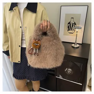 Winter fluffy plush handbag, stylish brown furry tote bag with cute pendant for women.