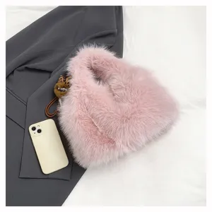 Pink fluffy faux fur handbag, cute winter plush tote bag for women, stylish cozy purse.
