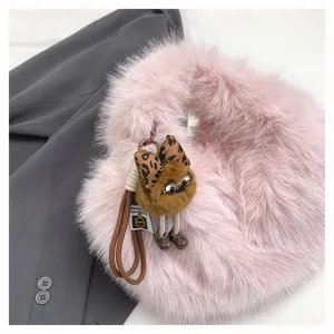 Winter sweet pink plush handbag with cute fluffy monster pendant, soft faux fur tote bag for women.