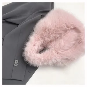 Pink plush handbag for women, soft furry tote bag with chic winter style and cozy design.