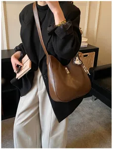 Detailed view of the stylish brown leather shoulder bag, perfect for daily commute and chic wear.