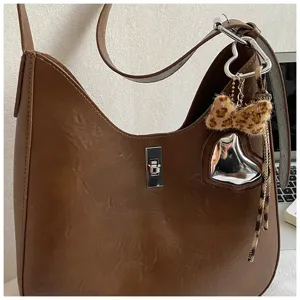 Women brown leather shoulder bag retro underarm bag stylish commuter handbag with chic pendant
