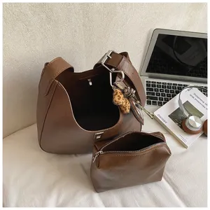 Brown PU leather hobo bucket bag and matching pouch detail, stylish commuter daily handbag.