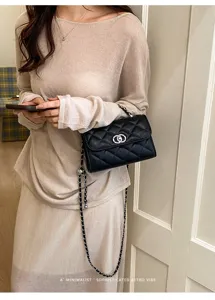 Classic quilted chain crossbody bag for women, elegant black shoulder bag with metal strap.