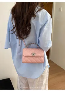 Stylish pink quilted chain crossbody bag featuring metallic clasp for daily wear.