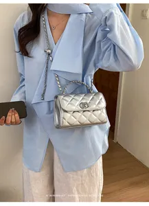 Silver quilted chain handbag, stylish shoulder crossbody bag with classic diamond pattern for women.