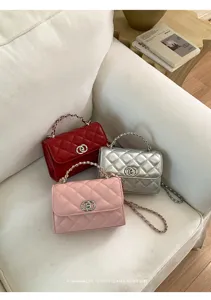 Chic quilted chain shoulder bag with classic lock design, elegant and versatile daily purse.