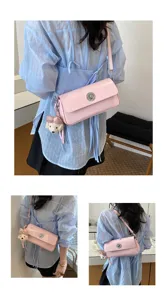 Pink patent leather shoulder bag for women, stylish crossbody bag with metal lock and cute bear pendant.