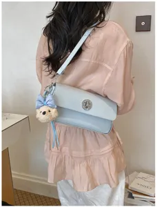 Korean style minimalist shoulder crossbody bag featuring cute plush bear pendant for women