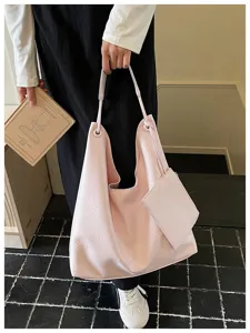 Pink soft leather hobo shoulder bag with attached small pouch, casual minimalist commuter tote.